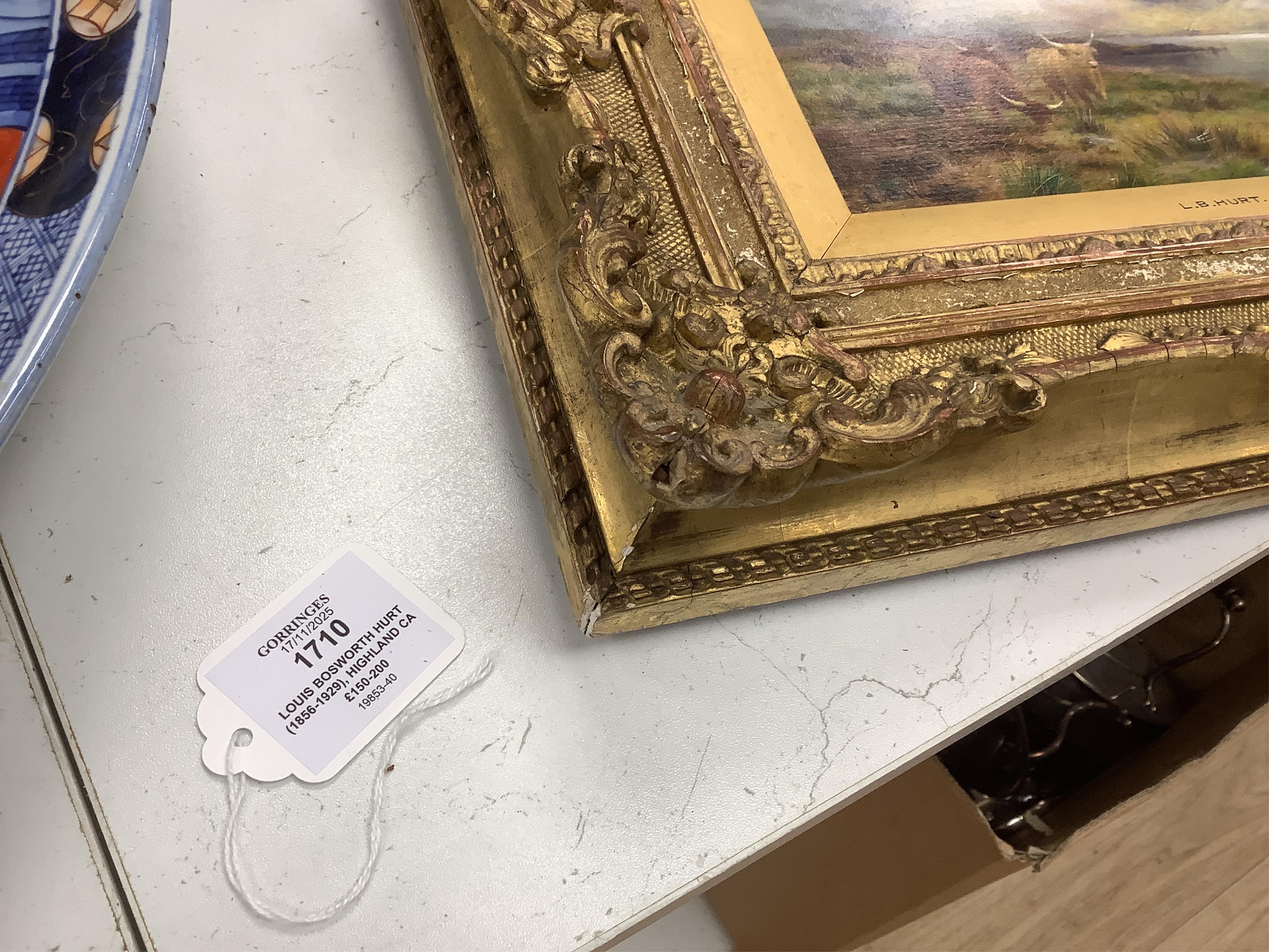 Louis Bosworth Hurt (1856-1929), Highland cattle by a loch, signed, oil on board, 12 x 23cm